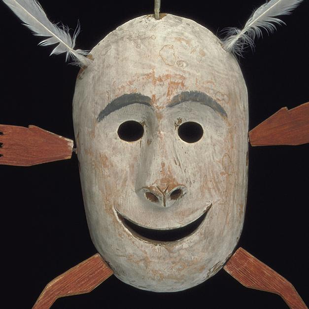 YPM ANT 015918: White wood mask.  Smiling, three feathers, arms and legs.  Nunivak Island, Canada