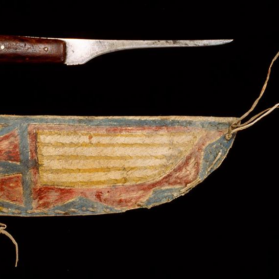 YPM ANT 049081.001: Boning knife with iron blade and wooden handle. Painted rawhide sheath.  Sioux culture.