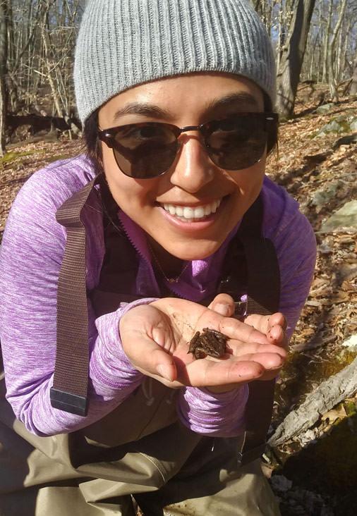 Yale doctoral candidate and herpetologist Yara Alshwairikh with a Wood Frog.