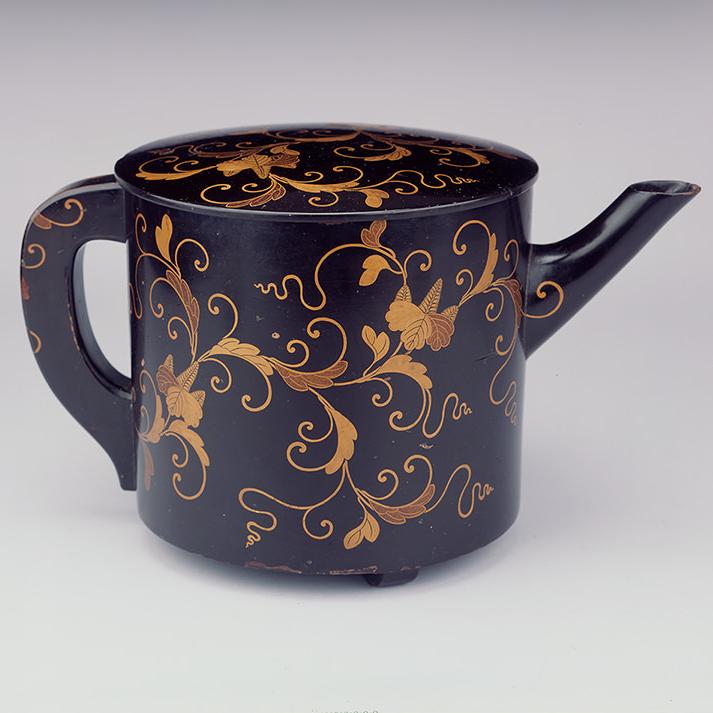 YPM ANT 231936: Black lacquer teapot and lid with gold floral design. Hokkaido, Japan