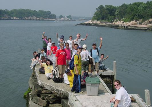 Students waving at the Horse Island dock