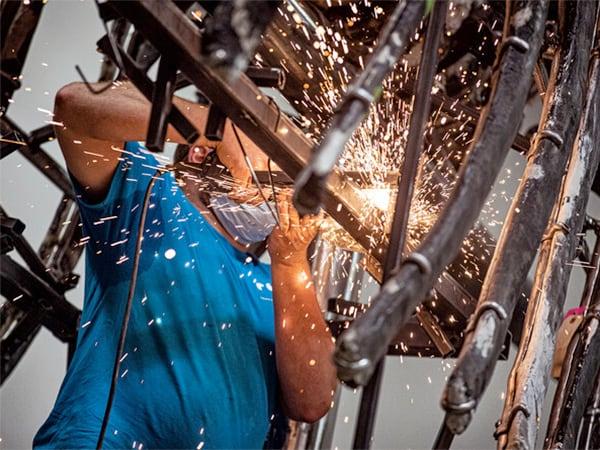 Sparks flying from welding in RCI's blacksmith shop